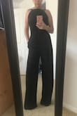 I was a little hesitate to purchase this jumpsuit since I'm short, 5ft tall. Everything fit true to size except for the length, which I expected. Had to get hemmed 5 inches so it's very long but otherwise perfect fit. I wore this without a bra and was very comfortable. Loved it and will definitely wear again! - Sharon P.