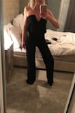 I haven't wore this to my event yet, but as soon as I tried it on I was in love with this jumpsuit! Fits great, and I can wear a deep plunged strapless with it (wearing in pic). - Shelby C.
