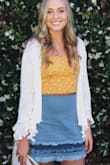 This is the cutest skirt! I love the ruffles and it is such a flattering fit that can be worn with almost anything. - Taylor H.