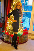 The black bodycon turtleneck dress fits perfectly and is so comfortable! It is very versatile where I can dress it up with jewelry or wear it casual with a fur vest. I am wearing it for a Christmas Eve celebration with silver jewelry and over-the-knee black boots in the photo. I love it! - Susan E.
