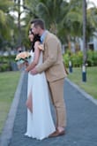 I am so in love with this dress! I wore it on my beach wedding in Mauritius.
This dress is such a good quality and so well made. It's so elegant and romantic. I ordered it in size XS just because I want it to fit perfect around my waist and I didn't want it to be loose. Normally I wear size S in other clothes. I was looking for a simple long white dress with a slit and I was so happy that I found it! I received so many compliments from others and of course from my husband when he saw me walking down the (beach) aisle in this amazing dress! Perfection! - Mirela V.