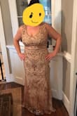 As soon as I zipped it up, I knew it was perfect! It is a little darker in person than the website shows, it's more of a tea stain color. I was looking for an old Hollywood glam style dress and this is perfect! It's a little long on me becayse I'm only 5'4" so I'll have to have it altered but I'm totally happy with the fit. - Katherine E.