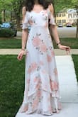 Wore this dress to my bridal shower. So many compliments. It fit perfectly. You can not wear a typical bra with this due to the back. Also, I did have to wear a tiny wedge heel (maybe an inch) so the material didn't drag. - Sarah S.