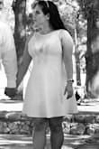 I ordered this dress for my engagement photos. It fit almost perfectly. I had to have the straps taken in about an inch and a half. Other than that, it fit like a glove. The dress is short enough: just short enough to be flirty and cute, but not so short that I felt like my butt was showing when I moved. - Patricia P.