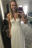 This dress is way more lovely in person. It was a little long and the bust is a little loose but honestly, it's not noticeable. I only altered the length of the dress so I wouldn't trip on my wedding day! 
The back lace is super pretty, the simple front is so classy and elegant. My wedding is next week and I'm so excited to wear this dress! - Serah A.
