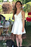 Super cute summer dress!! I wore this for my post-wedding event on a hot day in May. I have a small bust, so I had to sew up the very low cut V front (it would have shown my bra every time I moved) but I think it looked pretty cool with a keyhole. I wore a sticky backless/strapless bra with this. It is pretty short, but has a second thin tight fitting skirt layer underneath. Also this dress material is pretty thick- makes it not see through, and the dress is still cool with the very open back! - Stephanie P.