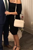I wore this to my boyfriend's work party. It is actually a pretty thick material. It was tight, but in a good way! It hugged all the right places. I ordered a medium. - Katie F.