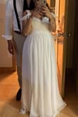 I absolutely loved this dress! I'm a size 8-10 & I had to size up to a XL. I got it altered because it was too long. I wore this to my beach wedding and it was just what I had imagined my wedding dress would look like. It was simple yet elegant! - Stephanie M.