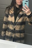 On the model this coat looks great. On me it looks dumpy. The material is lumpy and not any structure what so ever. Not for me!! Not good quality. - Avianna D.