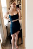 I purchased this dress for NYE and it was perfect. The cutout took it up one level from a typical cocktail dress. The dress was long enough that I didn't feel overly exposed. The neckline is a scoop neck which I found really flattering. I loved that it was a dark green! I got a lot of compliments. I'm sure I'll get a lot of use out of this dress! - Emily I.