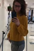 I love this sweater! It's shorter and I would consider it a crop sweater, but I'm also pretty tall at 5'9". I usually put a cami or tank underneath though and it looks great! It's also pretty warm and cozy. I would definitely buy this again! - Danielle R.