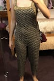So excuse my poorly taken photos. They're just to help others with a similar body type get an idea. 
I loved this jumpsuit in theory and the print and all, but man did it just fit funky. I am always a medium in Lulus, but this isn't Lulus brand. Maybe that was the problem. 
The fabric was bunchy and wavy pretty much from bust to crotch and it is because there is an unflattering seam down the middle that also cheapens the jumpsuit. 
The other really weird thing was this excess fabric on either side of the hips. It was kind of like they were going to put pockets in and then didn't. It is really unflattering. Lastly, I'm 5'8 and I wasn't wearing heels or anything, but the jumpsuit seemed too cropped and more cropped than it did in the photo. 
Overall, this look may be better for less curvy women, but I just can't imagine the side excess fabric on the hips would looking flattering on anyone. 
Unfortunately I bought this on final sale so I can't return it, otherwise I 100% would. - Rebecca V.