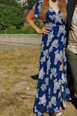 I love this dress because it's so comfortable and easy to wear! I've already worn it to my friend's wedding, a friend's rehearsal dinner, and date night with my man.
The slit is subtle and I tied the dress so that it's covered unless I sit down. I just made sure to keep checking on it, and then for photos you can open it up a bit.
I'd say that by Lulus standards this dress runs a little large (I also don't have a lot of bust for my size, I'm 36 B 1/2, so maybe it's just me). But I'm glad it ran large because then I can pull it in a bit more than the model.
The sleeves might not be everyone's fave.
And I'm 5'7" and wore it barefoot and it was just grazing the floor. Not really an issue though - Marianna H.