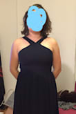 This was a beautiful dress that I really enjoyed wearing. After hemming it, it fit perfectly and was very comfortable. I also had to bring in the straps a bit but didn't need to wear a bra, even having a large bust. The material wasn't very stretchy but did have some give and didn't fit too tight at all. - Elisabeth L.