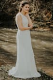 I bought this as my wedding dress and it is perfect! The other reviews said it was a size too small on the chest, but my chest isn't large and it fit me perfect! The underlining is tight which I didn't expect, but no issues there. I love this dress! - Brittany