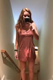 I am not a super big fan of this type of fit. It doesn't accent your waist at all. Also, I went a size smaller but is a little shorter than a medium would've fit. But the M would've been too big on my bust and waist. - Megan D.