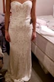 I LOVED this dress. I wanted it to be my wedding dress so bad, but it was too dressy and a little too heavy for our casual outdoor June wedding in the vineyard. It does have a slight fancy banquet feel to it. It's gorgeous, elegant, and lays on your body perfectly. It will hug your curves in the right places. - Maria S.