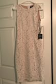 When I first saw this dress online, I was immediately drawn to it. I loved the lace and the slit in the back. In the picture it looks very white with only a little nude slip underneath, but in person the dress is WAY more nude than I initially imagined, which threw me off. The only reason why I rated this dress as a little small was because it was hard/tight to get on, but once it was on it was very comfortable and easy to sit and didn't feel tight at all. I am bigger chested and with a bra on, it still fit nice in the bust. Getting the dress off was almost a two person job though, and personally the length was not flattering on me. Overall, the dress is still very elegant and mostest, great for a rehearsal dinner or formal event, and very great quality material and lace. - Kaylee R.