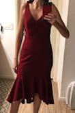 I ordered this for a wedding. Hated it. The fabric is very heavy so it pulls down. It got me much lower on the legs than I thought and this isn't usually an issue for me since I have very long legs. For anyone smaller chested like myself, it didn't help the bust area as it felt weighed down. This went back right away. I was so bummed because it's so cute on the model. - Melanie R.