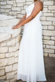 This dress was perfect for a small waterfront wedding ceremony out in Texas. It was flowy and had an amazing relaxed fit that allowed it to be comfortable for extended period of time. I ordered stick on bras to ensure it was a very clean look. The dress went all the way to the ground even with 4inch heels on, but it wasn't dragging so it worked perfectly. This was a great purchase. - Devona T.