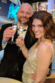 I wore this dress for NYE and loved it; however, I ordered a size smaller (XS) than what the size chart specified was my respective size. It fit well. The length was still a little long, but with 5 inch heels ( 5" + height of 5'3" = 5'8") it was perfect. The dress has an elegant, sleek, "hanger effect" type look. It is also probably important to mention that the dress appears to be more of a muted GOLD or champagne (ironically, reference champagne picture) than SILVER because of the cream colored underlay. - Natalie J.