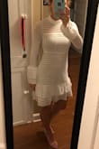 This dress is adorable. It is fashion forward without trying too hard. I am looking forward to wearing this for my bridal shower or rehearsal dinner. My only complaint is it is more see through than I anticipated (the risk you run with white clothing). The top is fine with a nude strapless bra, but I intend to search for a form fitting white or nude skirt slip to add an extra layer. - Amber W.
