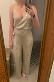 Ordered both a medium and large as I am often between. This is not the longest jumpsuit and cuts off right at the top of my foot with the medium. The fabric is soft and comfortable and the straps feel very secure. Decided to go with the large as it fit my torso and leg length a bit better. - Chelsea E.