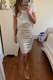 In love with this skirt! It fits true to size and accentuates curves. I am wearing a size small. I paired it with a T-shirt to offset the flashiness of the sequins and plan to wear my open toed heels. - Joanna R.