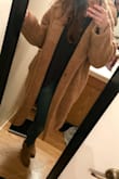 As other reviewers have said, the coat is fairly large. From certain angles it's not super flattering, but overall I'm happy with the oversized fit. The material isn't itchy, and the liner feels high quality. Most importantly, the coat is INCREDIBLY warm! It's like wearing a cozy blanket. - Raelyn T.