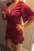 I love this dress. The color is amazing and the fabric is great quality. I like dresses that have a bit of femininity to them and the ruffle and side buttons really do add that touch. - Sarah K.