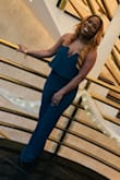 I am pretty short and got a size M. Although it was very long it fit all of my curves perfectly. I got the outfit hemmed 4 inches and wore heels so it was perfect. - Shantel K.
