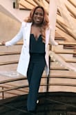 I am more on the curvy side, which made the jacket tight around the arms and midsection. I have a wide back but the jacket was so warm and went perfectly with my wedding outfit (also purchased from this website)! I bought a size S the arm length was good as well as the actual length of the jacket. All around amazing buy! - Shantel K.