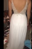 I absolutely love this dress. I will be getting married in April. I love that the beading is heavy. It shows that the material is super nice. The dress was really long and the straps need a bit of adjusting, but those are the only things that needed altered. It's a very comfortable dress. Pictures do not do it justice. It's so so stunning - Mackenzie R.