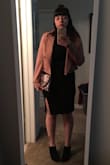 Though this dress is outside my normal style, I love the slit which contrasts nicely with the high neckline and long sleeves. The fit is bodycon but very stretchy, not constricting. The jersey-like fabric does show a lot of lumps and bumps, though, so if youve had a baby like me, Spanx help smoothen the overall look! - Christina O.