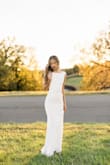 This number is stunning especially for those who are looking for a more modern and less frou-frou look. It is a true white color and I love the fit. Very flattering and accentuates your curves the right way. Just timeless and beautiful. - Kimmy H.