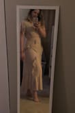 I picked out this dress to wear to my bridal shower because it looks white in the photos. In person, it's definitely more cream colored, even close to flesh colored. It's a beautiful gown and a beautiful fit, but I ended up returning it. It wasn't flattering because I am on the paler side and really wanted a true white dress. - Laurel B.
