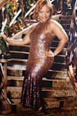 I bought this dress for New Year's Eve, but I'm going to wear it on two cruises and as many times as I can. The sequins are secure and the color is gorgeous. My hips are tight but somehow it works so, I wouldn't change it for anything. The length is perfect for my height and there was no need for tailoring. The only hiccup is that there is very little stretch in the material so I sat down in it for a few hours. That worked! I am a size 16 and I love it! (If you have full busts this dress will not work. I can wear it without a bra. I'm a small C cup.) - Felicia L.