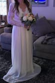 Bought this dress as a very last minute dress for a casual, at-home wedding with a rustic feel. It was absolutely perfect - it fit like a glove, only a bit too big for me up top, but not enough it was noticeable to anyone else. I am 5'3" - I wore flats and it hung over my feet a few inches which was perfect for the setting. If I wore heels, it would have been perfect. I had so many compliments it was overwhelming - I will be able to wear it again for a summer ceremony! Absolutely stunning! - Whitney F.