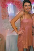 I ordered this in an XS, it was a little short but once I loosened the straps it fit perfectly. I got compliments on it all night, it does leave glitter everywhere and has a gold sheen but I love it. Great purchase!!! - Bailey M.