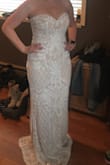 I absolutely fell in love with this dress! I could not stand the thought of paying 1500 plus dollars for a dress I would wear for 1 day. Great quality and people cannot believe it did not come from a high end bridal shop. I am adding a belt to it to add some of my wedding colors and have to get the bottom hemmed which is standard for me and dresses. 
You will not be disappointed. - Lo W.