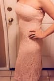 Love the dresses from Lulus. They really do fit so nicely and made really well. I didn't like the extra lace piece so I tucked it in. Here is a photo of it tucked in. - Jackie S.