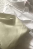 The dress itself is very pretty. It fits perfectly; however, I'm very disappointed about the color. This is a second "WHITE" dress that I ordered recently from Lulus, and both of them came out looking like that- yellowish. I'm not sure if washing with bleach would help... very disappointed. - Katarzyna L.