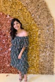 This was such a fun dress. I wanted to spin around all day. I was in between ordering a small and medium (as I always am), and I decided to go with the medium. It wasn't hugging but still looked great! Gives a lot of color and life. Comfortable, cute, and gives off fun vibes! - Dahlia C.
