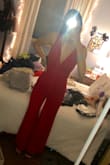I got this jumpsuit to wear to my graduation party. It fits so well and gives my body such a nice shape! I was afraid the neck would be too plunging, but it's perfect. The torso is a bit long so if you're shorter than me that might be something to think about. Regardless, I love it so much! - Peyton M.