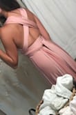 I love this dress! I own it in navy blue in the fabric that is matte/doesn't have a shine to it. Love that one too. This one doesn't have as much stretch as you would expect it to around the waist, but other than that it's great! - Kali H.