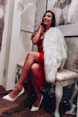 I bought this for a photo shoot exhibit event because it was vintage - retro themed! It fits very nicely (not too tight or too loose), and I like how the slit is not too high and showy. It only really shows leg if you put your leg out or when you sit down. I like the long length of it too, and the shape is very flattering on my body. - Felisha G.