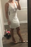 Tighter fit. Ordered a small and if I would have went up a size, it wouldn't have fit quite right. It's a tighter fitting dress. Didn't need to wear a bra & the fabric is thick. - Ashlee J.