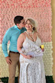 Excellent material, beautiful design, with the right undergarments even a bigger woman like me can wear it and still feel and look pretty. I used it for my vintage bridal shower, everyone loved it. The lower part of the dress will bring out your belly (for those that have a belly) unless worn with a body shaper. The color is perfect, high quality materials with a bit of stretch. Highly recommend, definitely bridal and lovely! I'm super happy with my purchase! - Carmen P.
