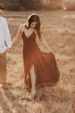 This dress is absolutely gorgeous! I loved the slit and the ruffles on the dress! I wore it for my engagement shoot. It is a beautiful
Color as well. I would definitely wear it to other events as well. - Briana M.