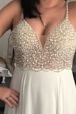 I will be wearing this dress to my upcoming wedding reception in Punta Cana! The pearl beading with rhinestones are the perfect combination- elegance and glitz!
I also love the sheer fabric on the sides.
The only alteration I will need is a few inches taken off the bottom
I feel like I will definitely be able to dance the night away in this one! So comfortable and fit for a princess bride. - Stephanie L.
